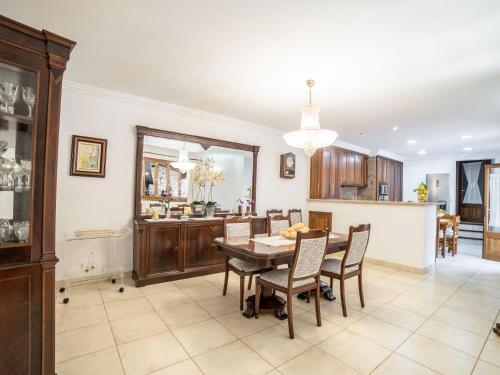 a kitchen and dining room with a table and chairs at Holiday Home Son Trobat by Interhome in Mancor del Valle