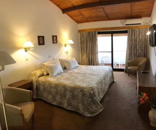 Katil atau katil-katil dalam bilik di Hotel & Apart Arcos del Rio