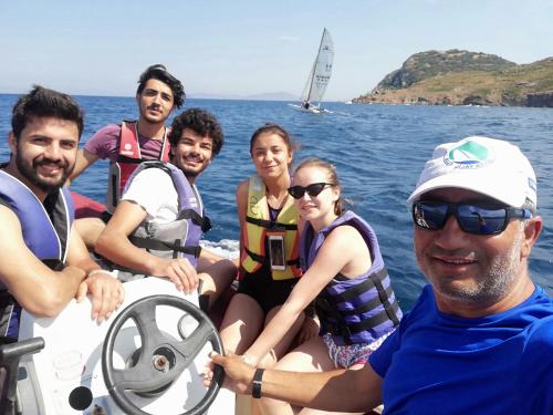 a group of people on a boat in the water at Paradise Gümüşlük in Gümüşlük