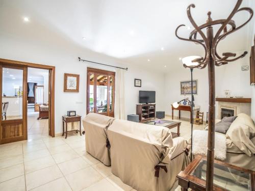 a living room with a couch and a fireplace at Holiday Home Son Trobat by Interhome in Mancor del Valle