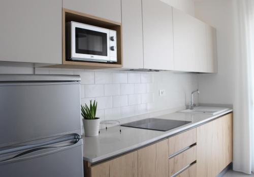 A kitchen or kitchenette at Dainese Apartments, Casa Miriam