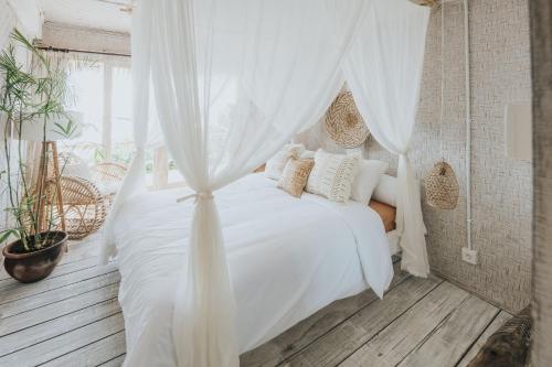 Ένα ή περισσότερα κρεβάτια σε δωμάτιο στο Dreamsea Bali