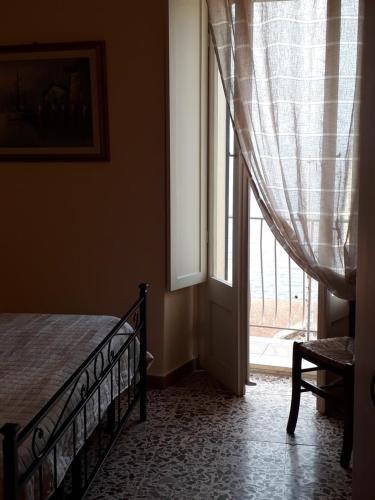 Postel nebo postele na pokoji v ubytování L'Antico Faro