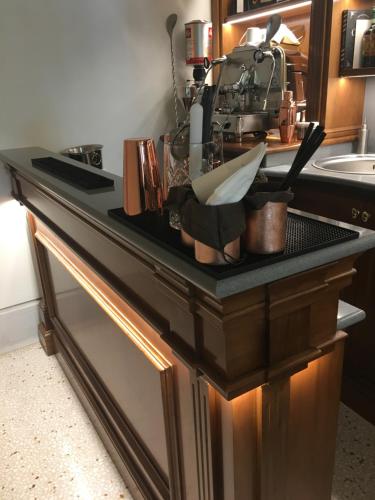 a kitchen with a black counter top with a sink at Ca' Bonfadini Historic Experience in Venice