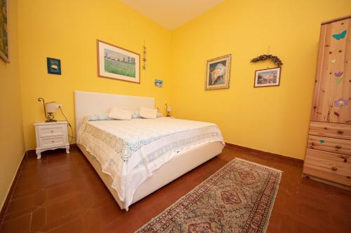 Posteľ alebo postele v izbe v ubytovaní Poggio degli Oleandri
