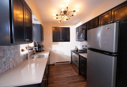 Una cocina o zona de cocina en Okemo Mountain Lodging