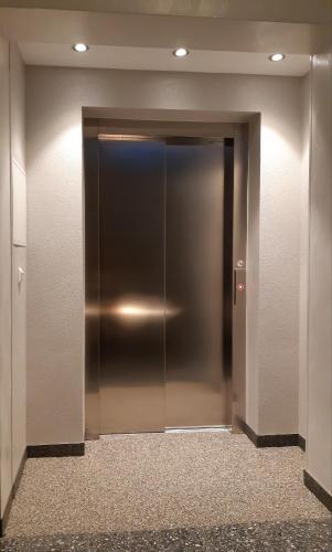 an elevator in a building with its door open at Gasthof Klug zum Ehrensepp in Modriach