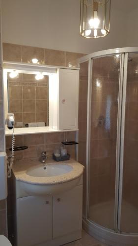 a bathroom with a sink and a shower at B&B Lo Slittone in Abetone