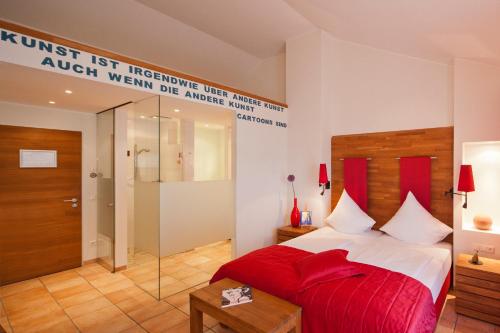 Malerwinkel Hotelにあるベッド
