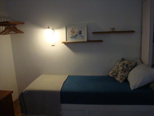 Кровать или кровати в номере Pasara apartment