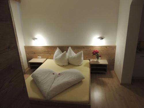 two pillows on a bed in a room at Häus`l am Ruan in Berwang