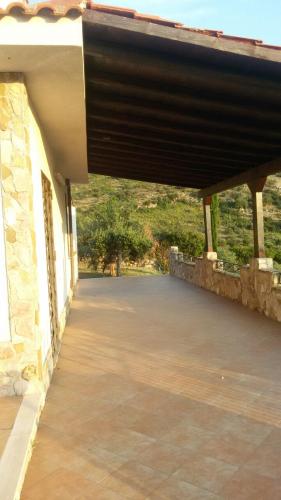 a porch of a building with a roof at Case Susinna in Capaci