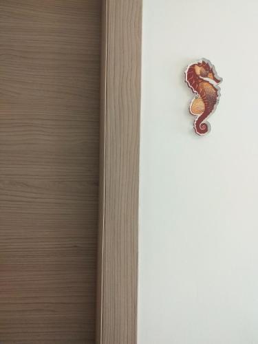 a close up of a door with a scorpion on it at B&B Marsà in Marzamemi