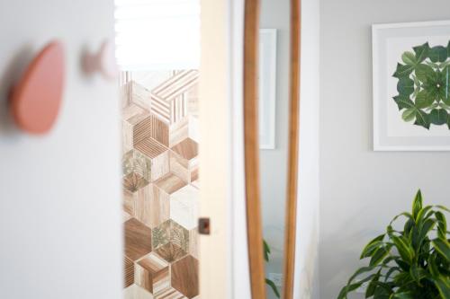 a room with a door with a lamp and a plant at Trópica Beach Hotel in San Juan