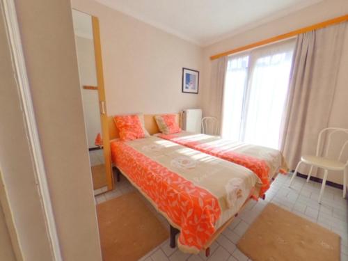 Ένα ή περισσότερα κρεβάτια σε δωμάτιο στο toplocatie Middelkerke frontal sea view