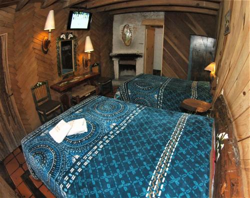 Postel nebo postele na pokoji v ubytování Hotel Cabaña Los Ruiseñores
