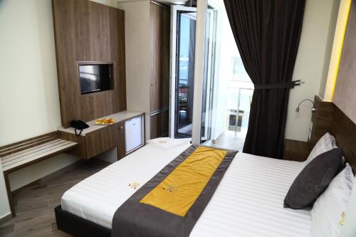 Vila One Beach Hotelにあるベッド