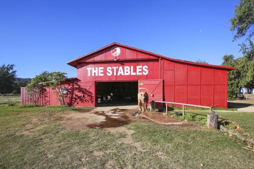 a red barn with the sticks written on it at Anthurium Condo in Kahuku