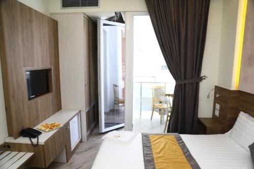 Vila One Beach Hotelにあるベッド