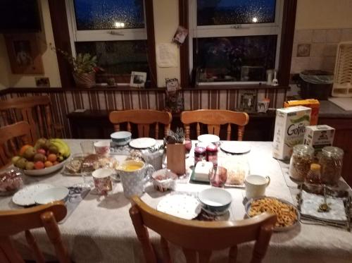 a table with a white table cloth with food on it at Antrim Heights Estate in Antrim