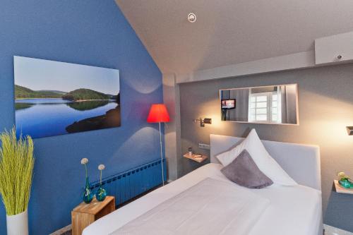 Malerwinkel Hotelにあるベッド