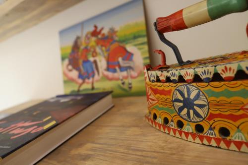 a colorful purse sitting on top of a table at b&b Pirriera in Bagheria