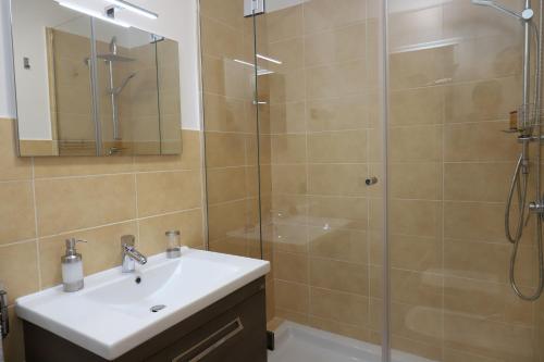 a bathroom with a sink and a shower at b&b Pirriera in Bagheria