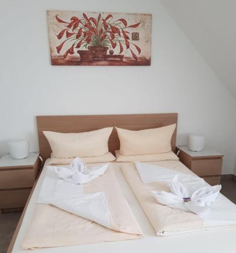 Ένα ή περισσότερα κρεβάτια σε δωμάτιο στο Apartments Marianna