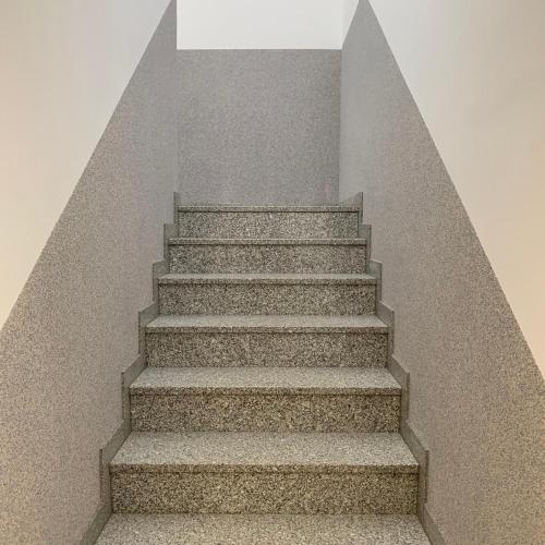 a set of stairs in a stair case at TWT Motel in Triptis