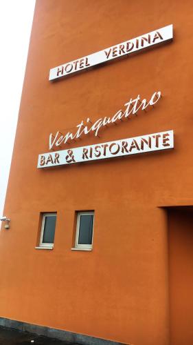 a building with a sign for a bar and restaurant at Hotel Verdina in Volpiano