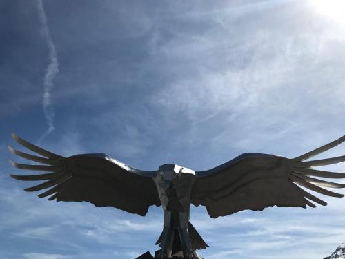 a statue of a bird with its wings spread at Chalet Casa Cresta - Top of Lenzerheide - bis 8 Personen in Valbella