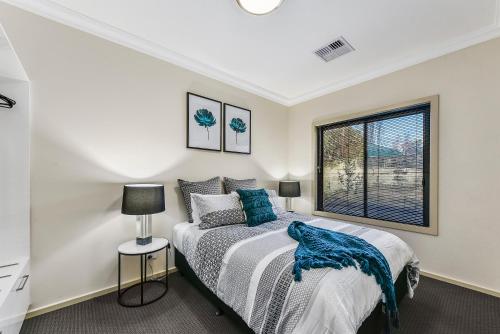 a bedroom with a large bed and a window at Accommodation on Lansell 2 in Mount Gambier