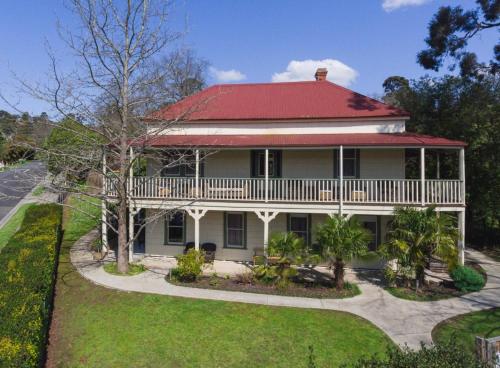 a large white house with a red roof at Healesville Garden Grandview in Healesville