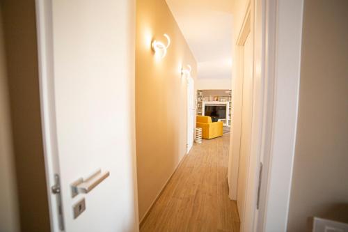 an open door with a hallway leading to a living room at Chez Moi in Foggia