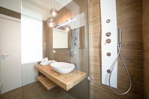 a bathroom with a sink and a shower at Chez Moi in Foggia