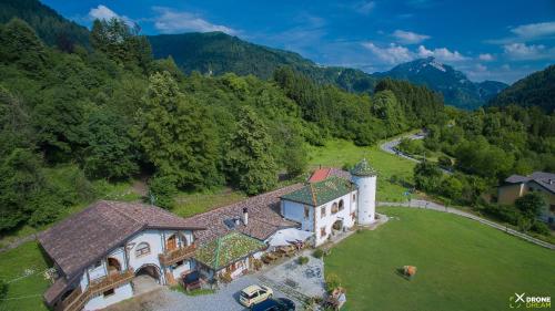 an aerial view of a house with a tower at Agriturismo Randis in Piano dʼArta