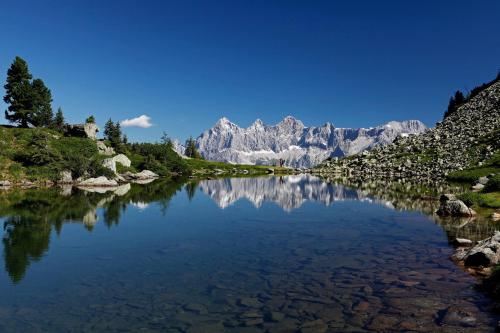 a view of a river with mountains in the background at Appartement Panorama in Gröbming