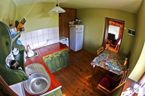 an overhead view of a kitchen with a sink at Poilsis pas Joną in Plateliai