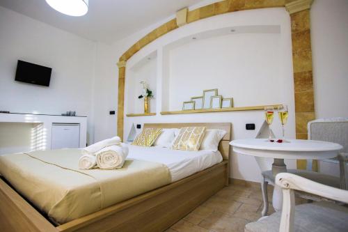 Postel nebo postele na pokoji v ubytování Il Baiocco affittacamere piscina & SPA