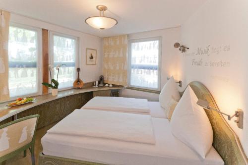 Malerwinkel Hotelにあるベッド