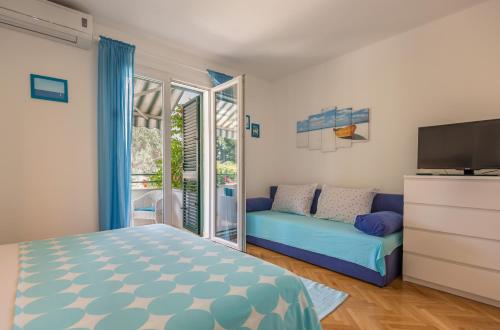 Postel nebo postele na pokoji v ubytování Apartmani Marko