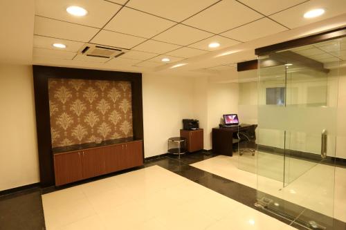 an office with a large screen in a room at Crest Executive Suites, Whitefield in Bengaluru