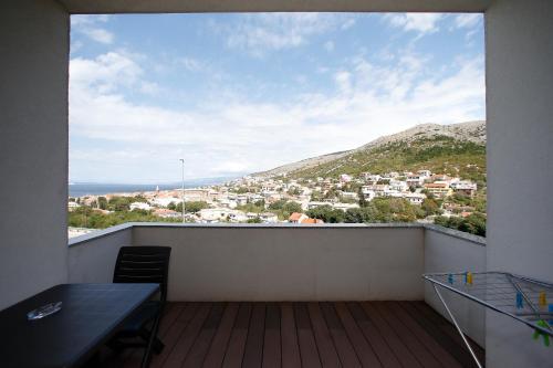 a balcony with a view of a city at BC Bikers Welcome Apartments in Senj