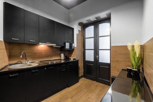 Virtuvė arba virtuvėlė apgyvendinimo įstaigoje Apartment Secret Place