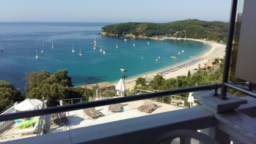 a view of a beach with boats in the water at Kanali Studios in Parga