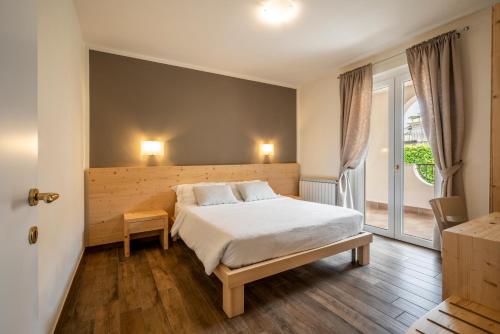 Ένα ή περισσότερα κρεβάτια σε δωμάτιο στο Residence Bianca