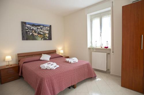 A bed or beds in a room at B&B Il Nido sui Trulli