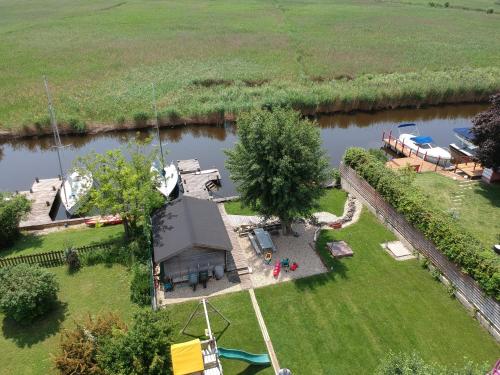 an aerial view of a house next to a river at 25h GARDEN Apartment PLUS private Beach in Neusiedl am See