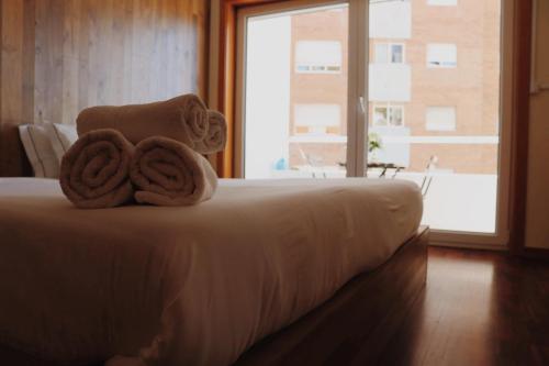 Ένα ή περισσότερα κρεβάτια σε δωμάτιο στο Oportocean Suites