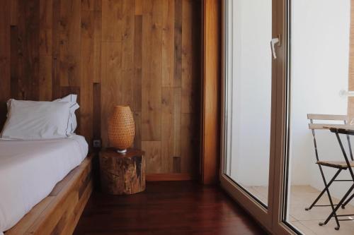 Ένα ή περισσότερα κρεβάτια σε δωμάτιο στο Oportocean Suites